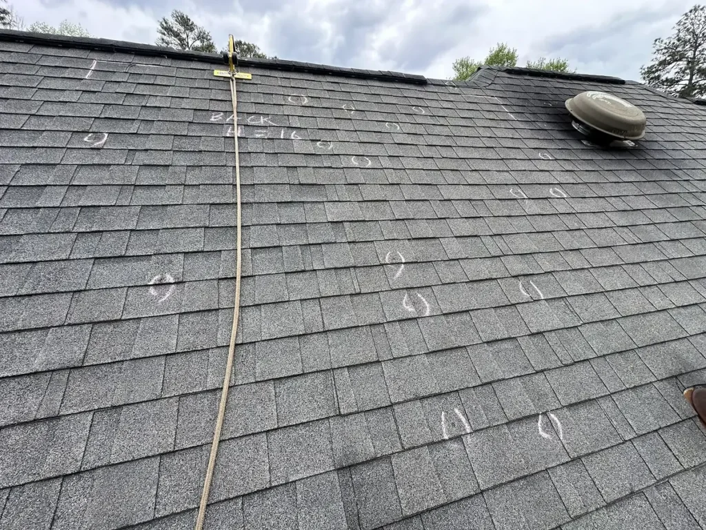 Hail-damaged asphalt shingle roof
