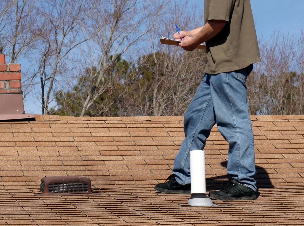 Licensed roofer performing a buyer roof inspection in Lincoln, NE