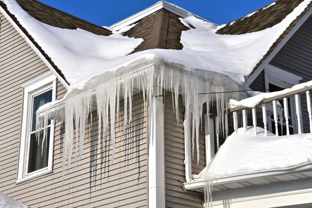 close-up photo of ice dam buildup at a roof eave